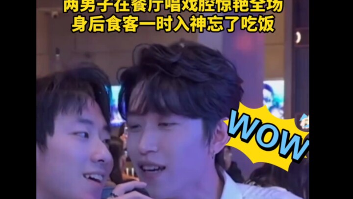 Two men belt out opera-style vocals in a restaurant, wowing everyone with their first note! Diners b