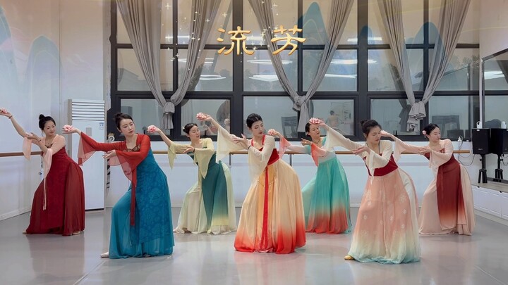 Flowers bloom with proud resilience, their national beauty shining in youthful splendor. The student