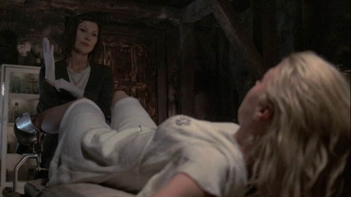 Husband’s bullets are malfunctioning; the perverse wife kidnaps a busty beauty to serve as a “breedi