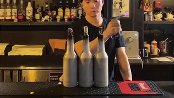 Bartender's Fancy Show: Three Bottles Creating Firework-like Sprays