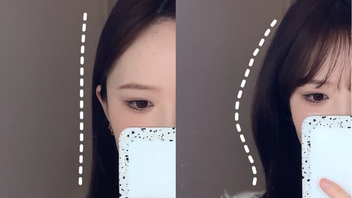 Gaya rambut simpul di belakang telinga dengan biaya rendah—tampak banget bikin wajah terlihat lebih 