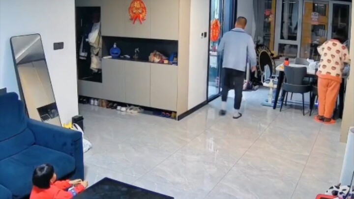 After learning his mom is sick, the man breaks down—his wife rushes over to comfort him, and their c