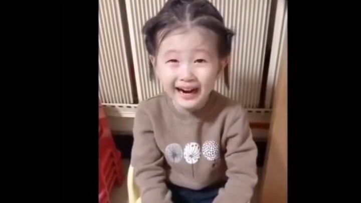 Even at such a young age, they already know how to force a smile!