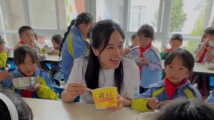 The teacher eats at the children's table