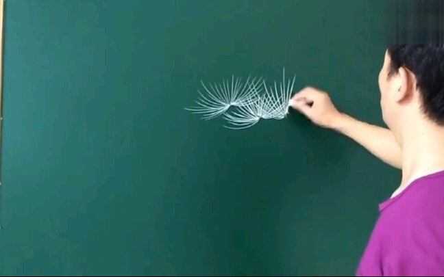 The art teacher draws a beautiful picture scroll with chalk.