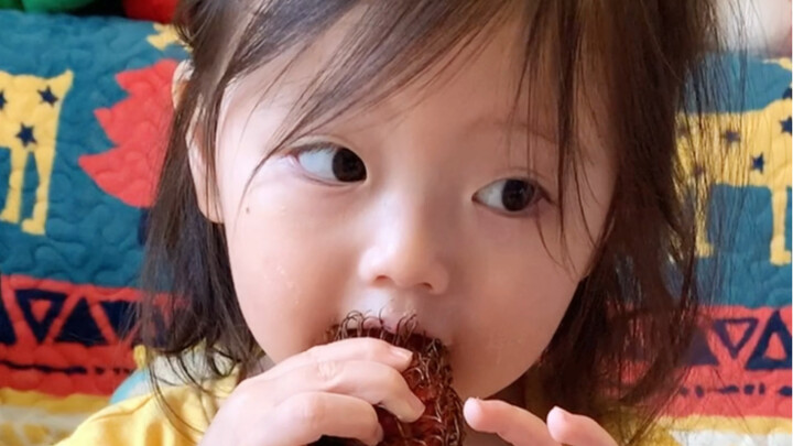 When a human baby tries rambutan for the first time...