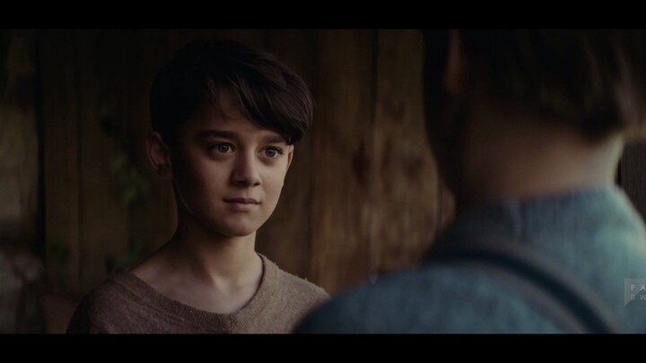 A boy actually has a wind-up key growing on his back…