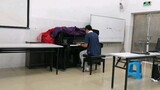 A middle student covers "Megalovania" in front of the whole school