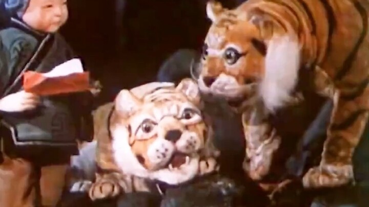 The old lady’s husband turns out to be a tiger—and he even cuddles up with her to sleep every day!