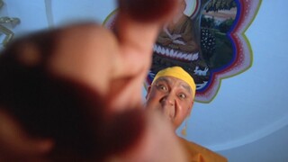 A black magic practitioner and a high-ranking monk engage in a battle of spiritual powers from afar