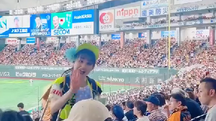 Cute Beverage Vendor in the Stadium Bleachers