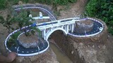 Người điên cơ sở hạ tầng thể hiện kỹ năng của mình! "Cầu vượt sông" tự xây đã thông xe