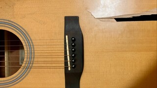 What does a guitar with a cracked top sound like?