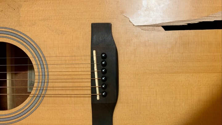 What does a guitar with a cracked top sound like?