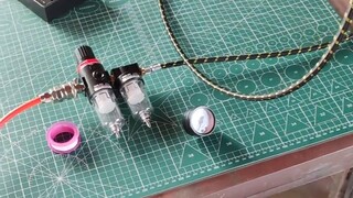 Pompa industri ATUS terhubung ke airbrush