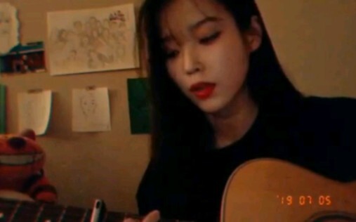 IU updated 2 clips of guitar playing and singing on Instagram