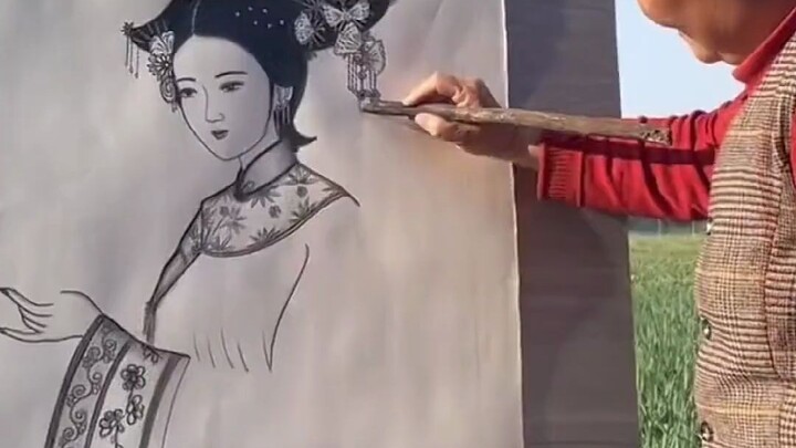 A rural woman paints with a firewood stick; netizens call her the “Divine Brush Ma Liang” of the fie