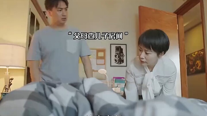 The boy hid something under the bed and unfortunately got caught by his mom.