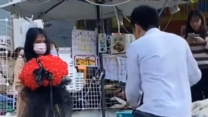 A man danced ecstatically in the street while holding a rose to propose, instantly turning it into a