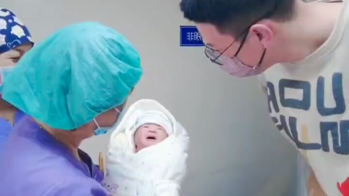 Dad meets his daughter for the first time—nervous and so tender, he just can’t get enough of her....