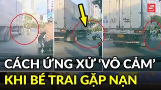 Bé trai đi xe đạp gặp nguy hiểm, cách ứng xử của người đi đường khiến dân mạng tranh cãi?