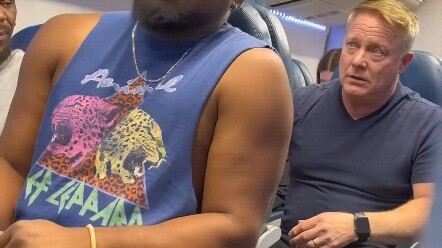 The person in the back kicks your seat with their foot.