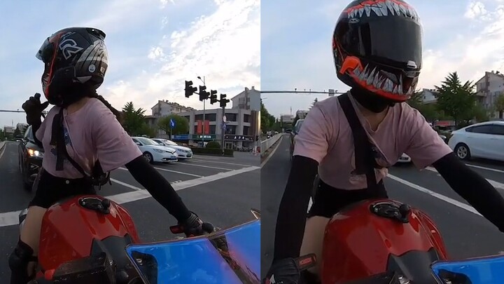 A female cyclist stopped to let pedestrians pass, but was honked at by the car behind her. The traff