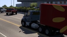 Transportation of a combine harvester by truck