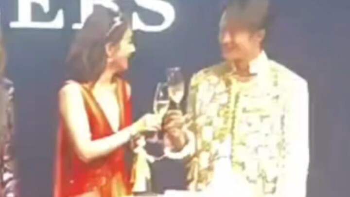 It's Duoduo baby who holds up a glass of wine in front of his sister and boasts that he is one year 