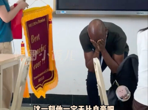 “To him, this banner is the greatest honor—‘Teacher’!”