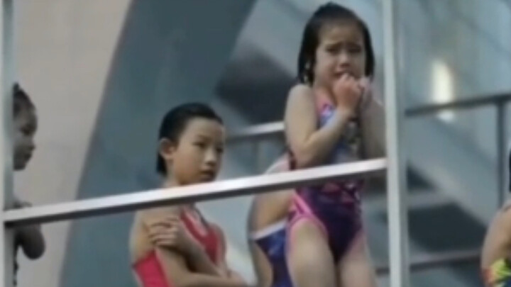 Overcoming her fear, a 5-year-old girl tearfully completed a dive from the 5-meter platform.
