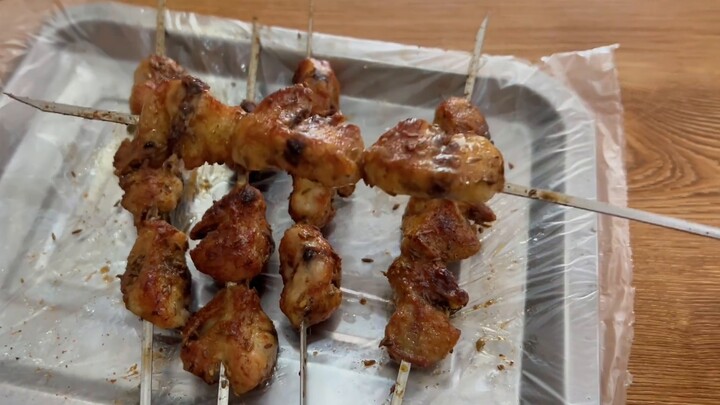 "Little Blackie, do you want to eat the chicken carcass?"