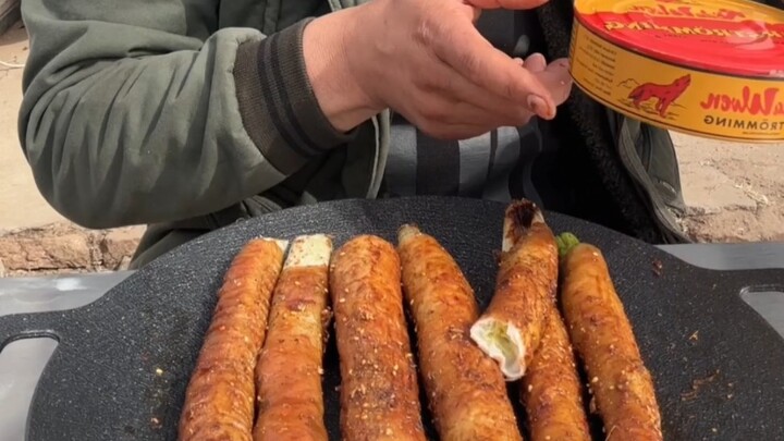 Pork intestine wrapped in scallions with canned herring—so delicious!