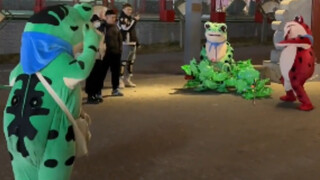 When three people wearing frog suits meet