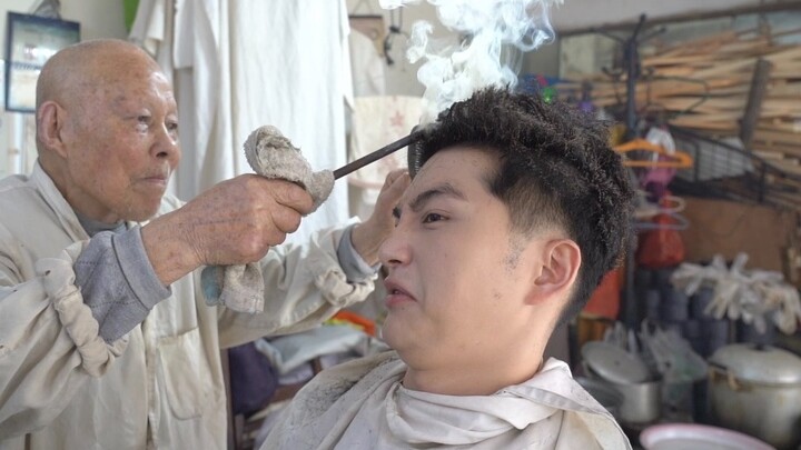 The cheapest hair perm in Wuhan costs 50 yuan per session. The red-hot iron rod will give you a perm