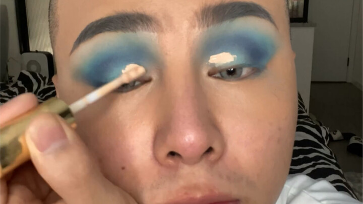 Is this even human? No filters, a serene makeup look—she ends up looking like an ostrich spirit.