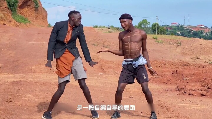 The two brothers danced the African god dance together. Their expressions and movements were very sh