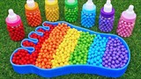 Children's handmade toys make rainbow feet with rainbow candies