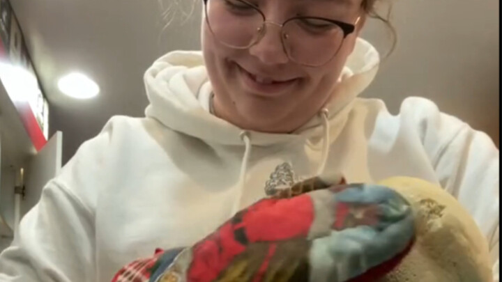 A girl trying baked bread for the first time