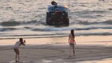 Square⬛⬜ and orange🧡 string bikini girls doing risky photoshoot with a tractor🚜 posing public beach