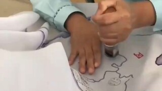 Man rides motorcycle across China, stamping a souvenir at every stop