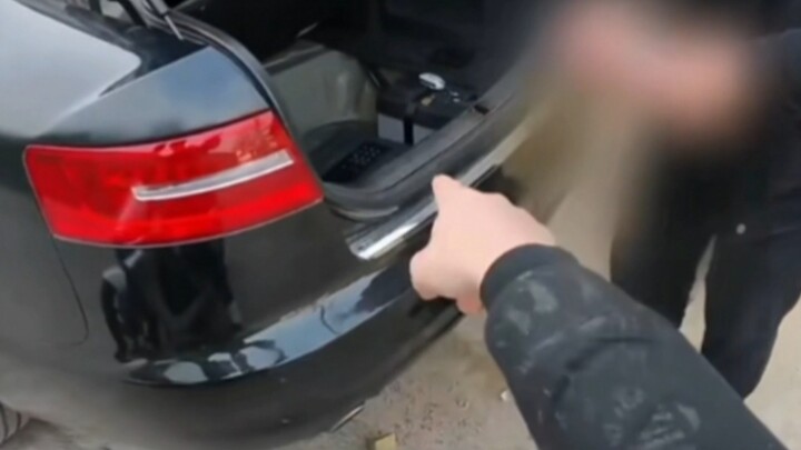 While picking the lock, I stumbled upon a Zhao Dehan! An a6's trunk contained a safe holding over th