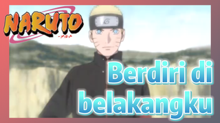 Berdiri di belakangku
