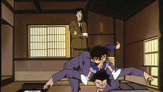 Conan ride Kogoro's back