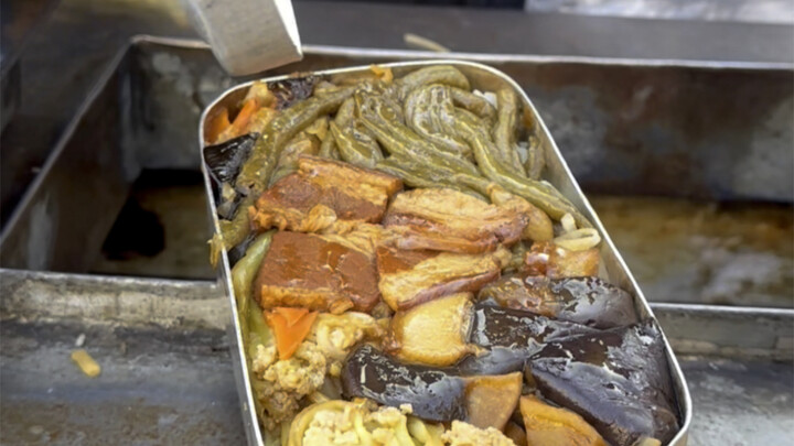 Iron lunch box lunch at a roadside stall in Northeast China
