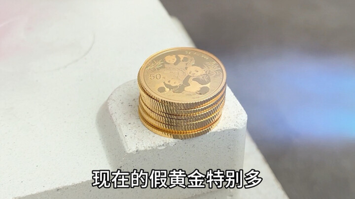 Stack ten gold coins together and burn them.