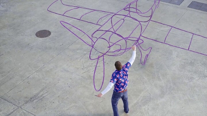 This man just doodled randomly, and suddenly the lines in midair transformed into an airplane!
