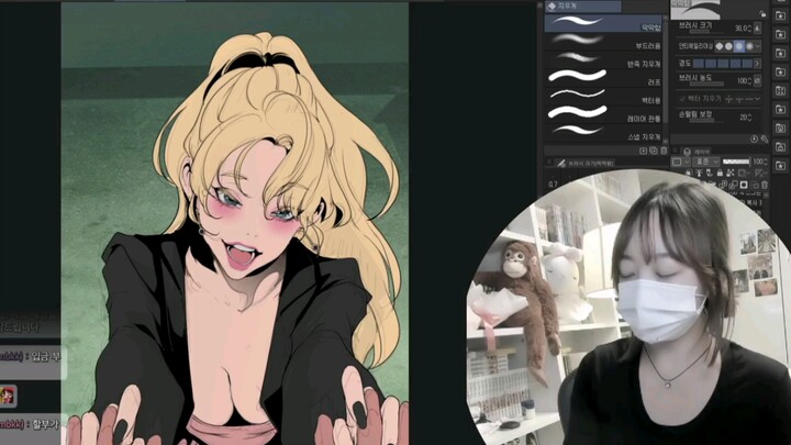 Yoon Kun-ji, the author of Beautiful New World, a Korean webtoon, focuses intently on drawing.