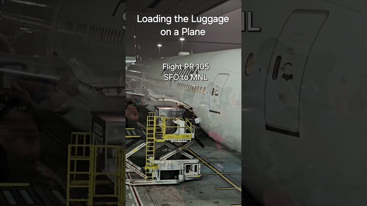 Philippine Airlines Loading the Luggage on a plane