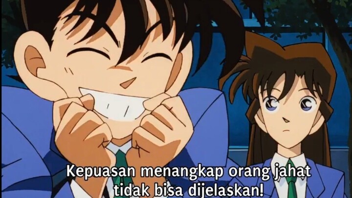 Gambarin Kudo yg tidak bisa menjelaskan perasaan setelah menangkap penjahat